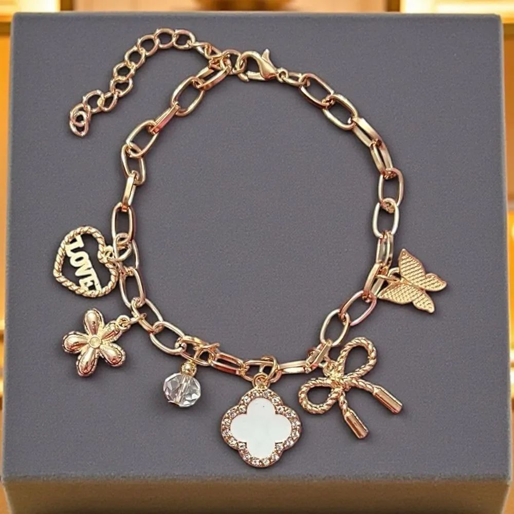 Gold Bracelet with White Clover Heart Bow Butterfly And Flower Charm